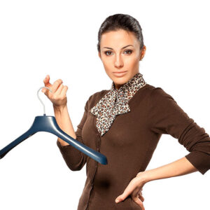 Woman holding a clothes hanger